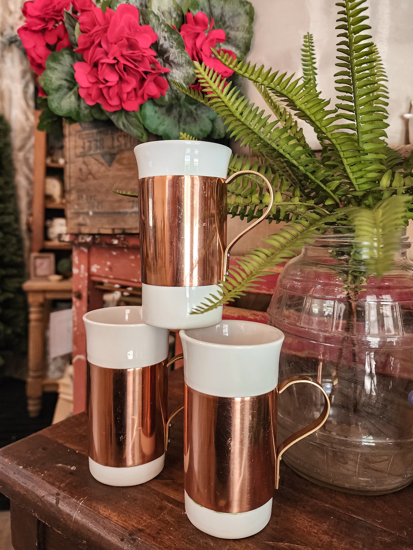Set of three ceramic and copper mugs
